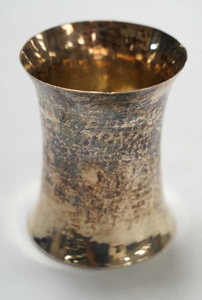 An Elizabeth II Irish planished silver beaker, William Egan & Sons, of waisted form, Dublin, 1964, 88mm, 5oz. Condition - fair.